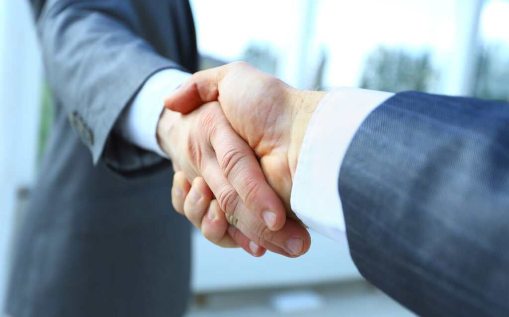 Two businessman shaking hands
